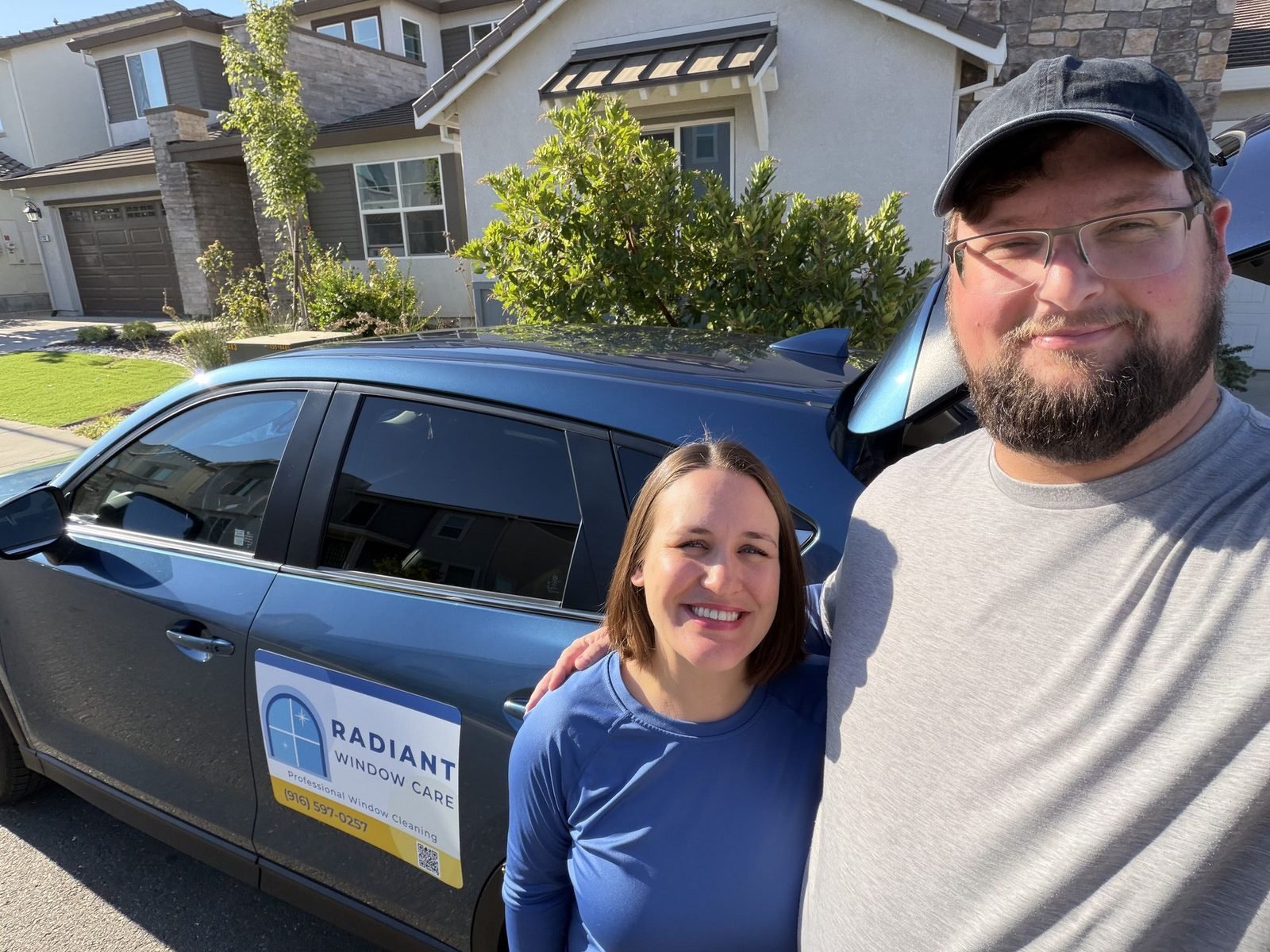 Alex and Molly, owners of Radiant Window Care, with their service vehicle at a job in the Sacramento area