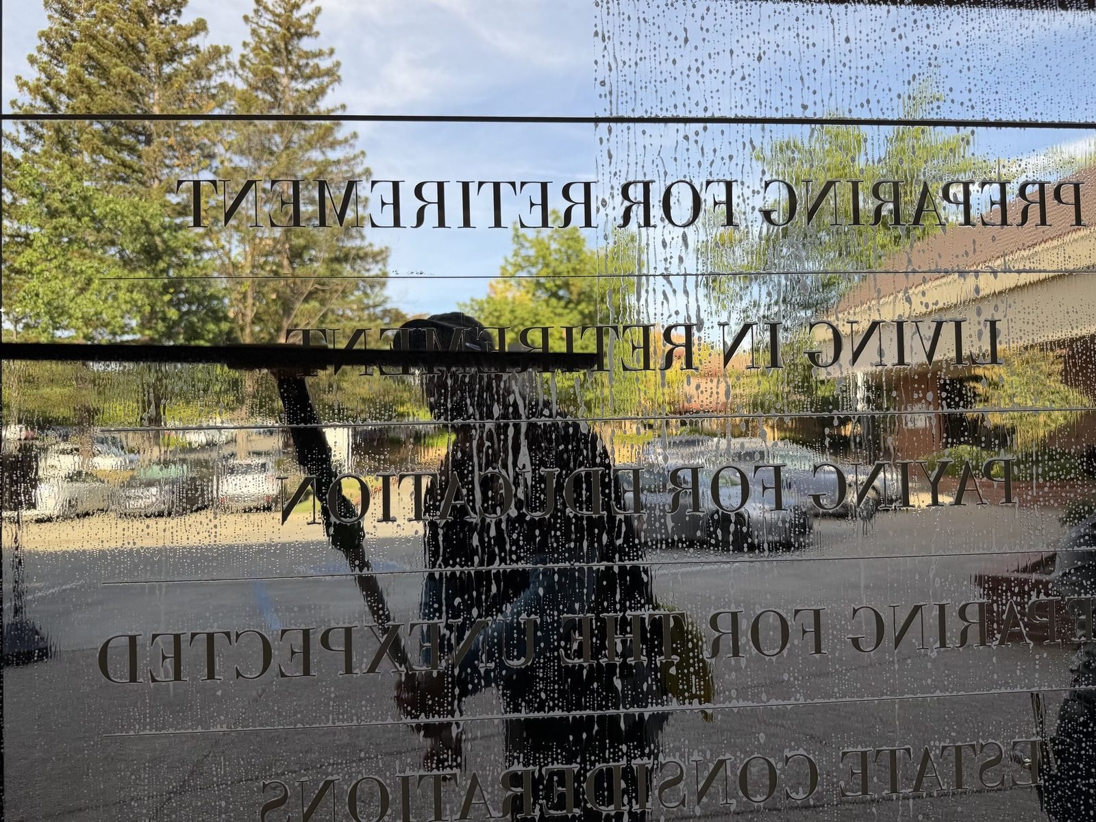 Cleaning full-height storefront glass at a business in Auburn, CA