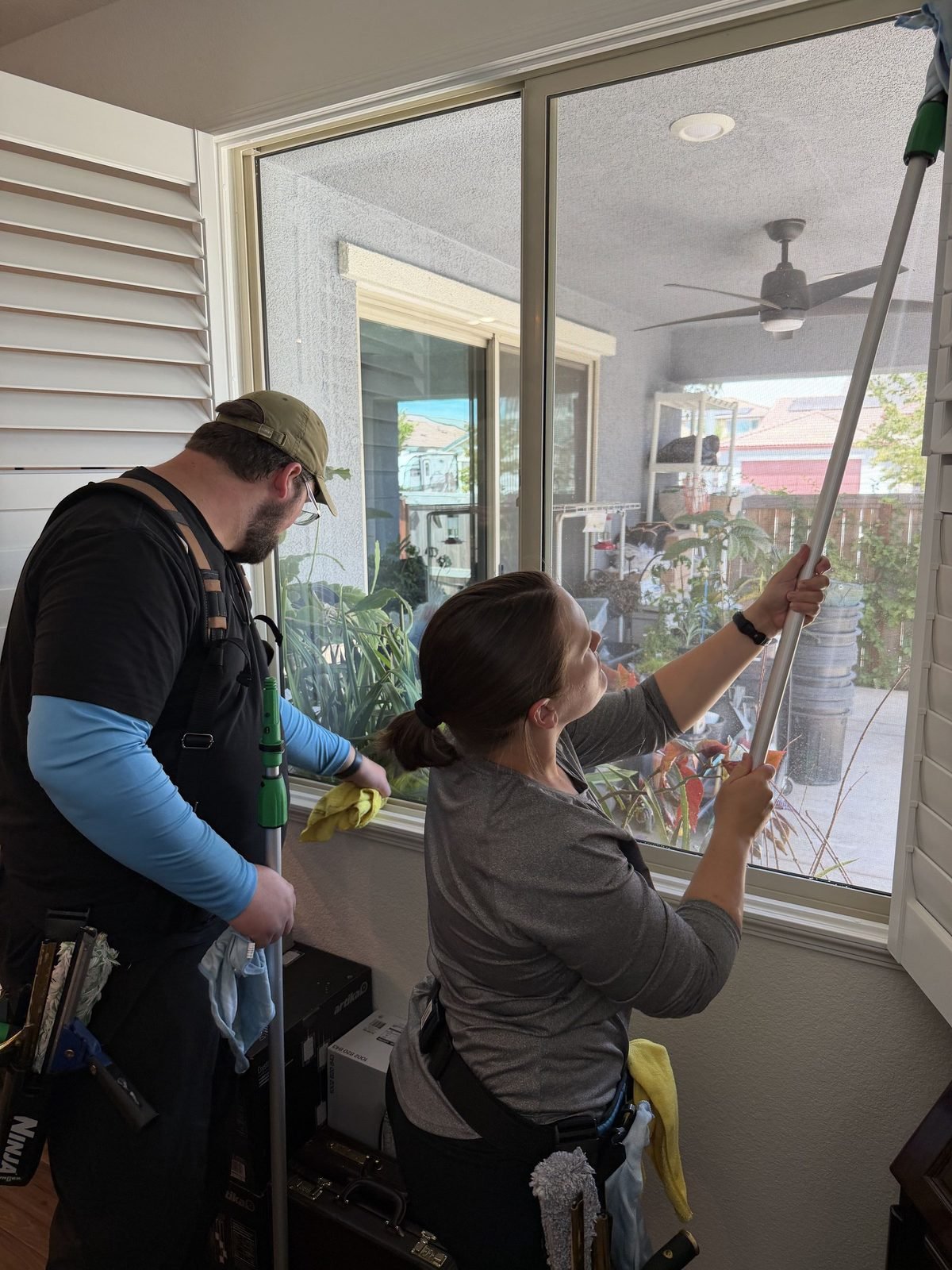 Alex and Molly cleaning interior windows at a home in Anatolia, Rancho Cordova, CA