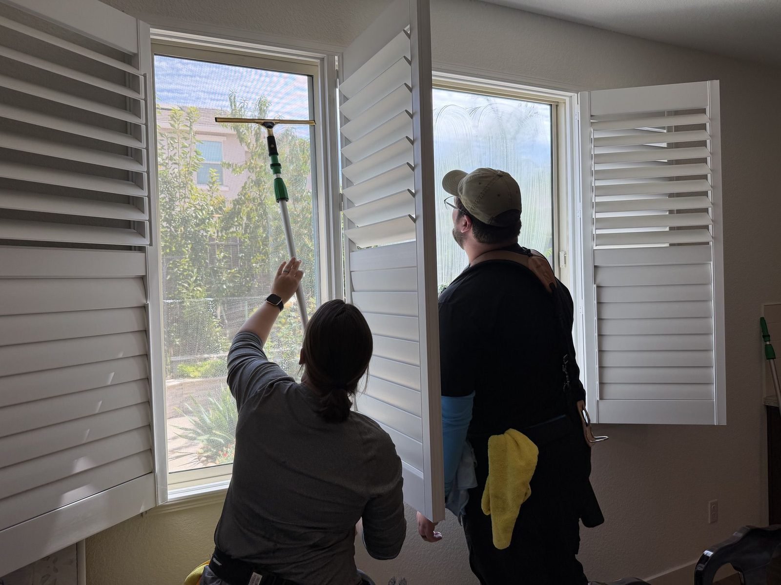 Interior window cleaning behind plantation shutters at a home in Anatolia, Rancho Cordova, CA