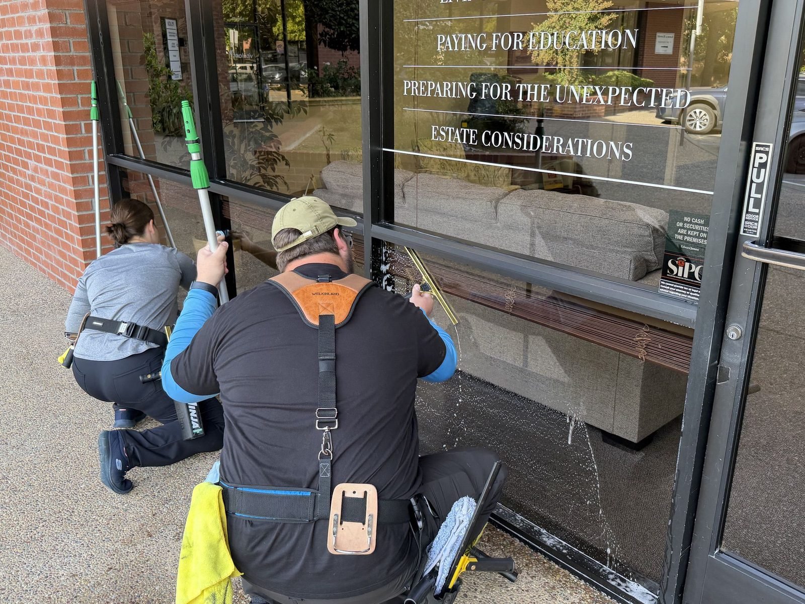 Radiant Window Care cleaning storefront glass for a business in Auburn, CA