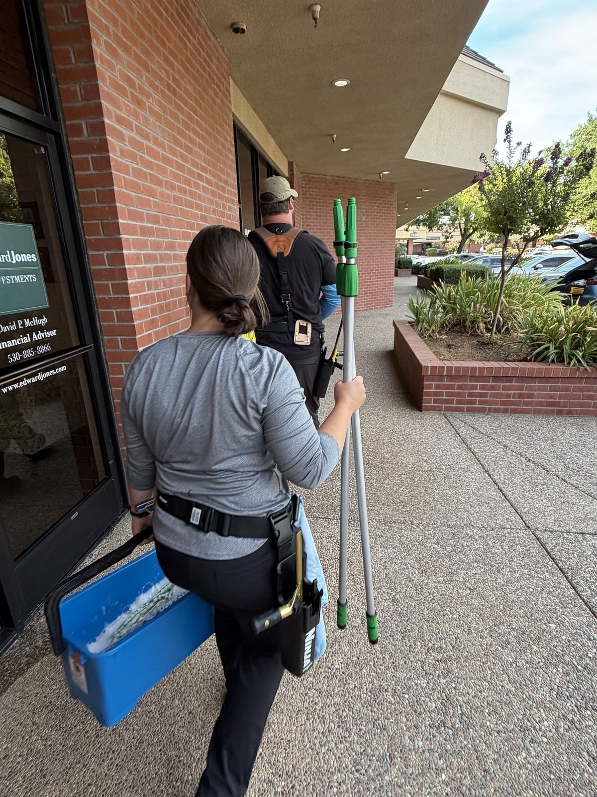 Radiant Window Care arriving for a scheduled cleaning with buckets and poles in Auburn, CA
